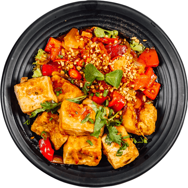 A plate containing chicken with appetizers